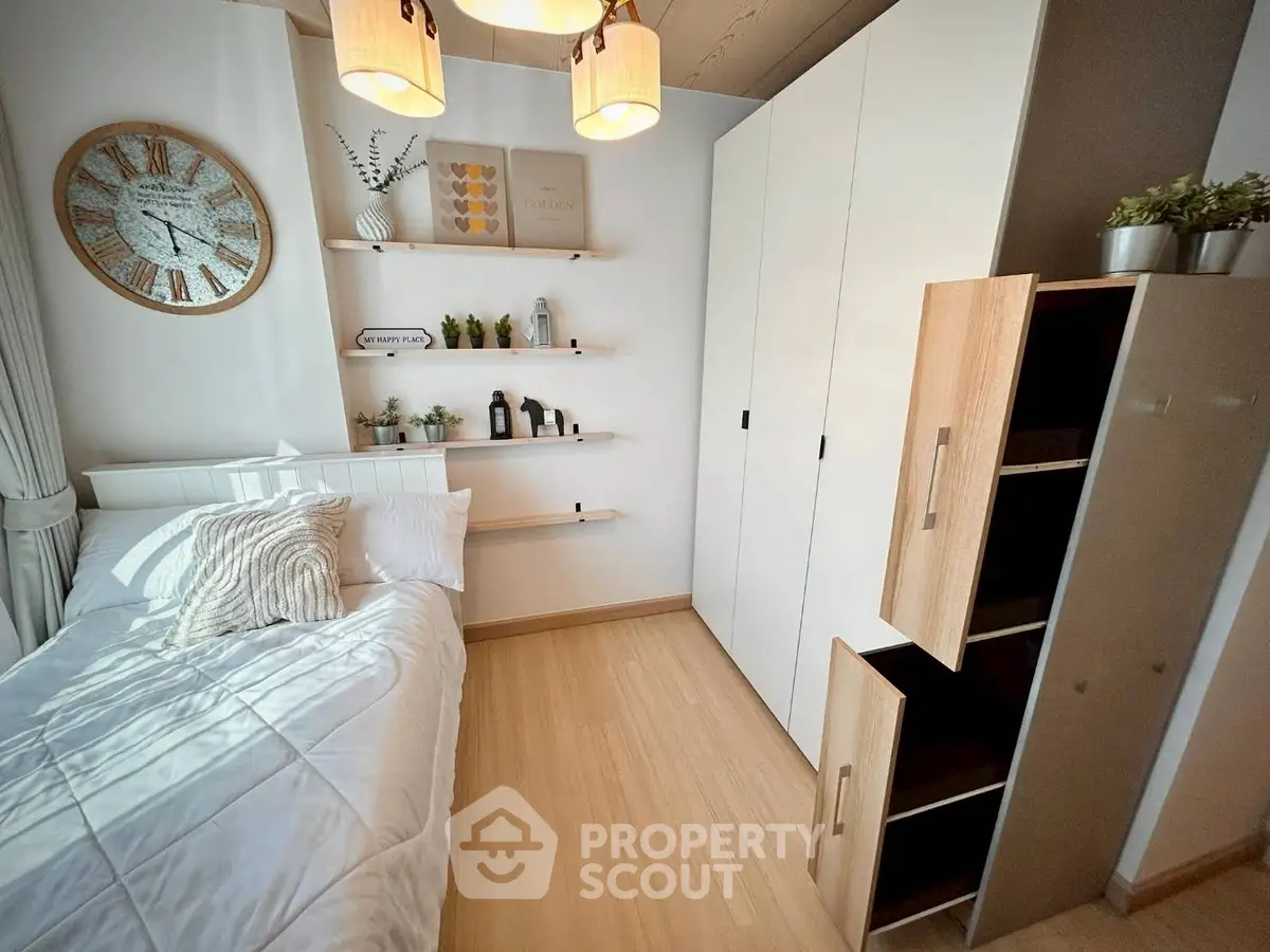 Cozy bedroom with modern decor and ample storage space