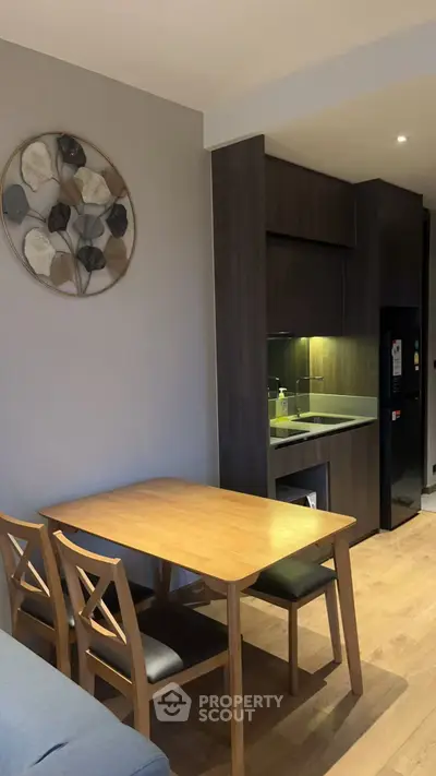 Modern kitchen with wooden dining table and stylish decor