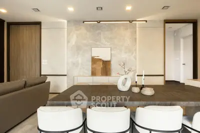 Modern living room with elegant dining area and stylish decor