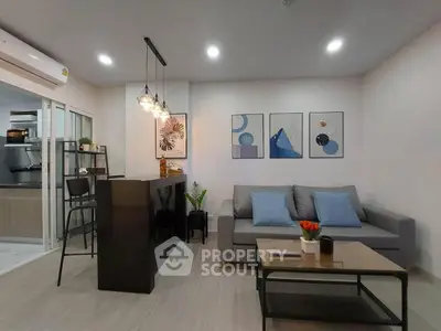 Modern living room with stylish decor and open kitchen layout