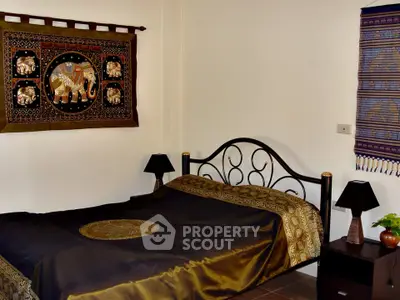 Elegant bedroom with artistic decor and stylish bed frame