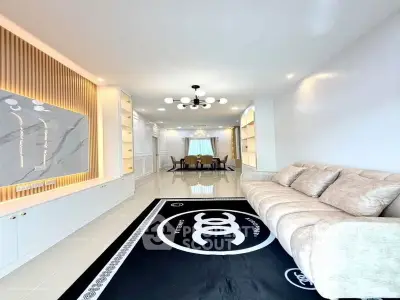 Spacious modern living room with elegant decor and ample natural light