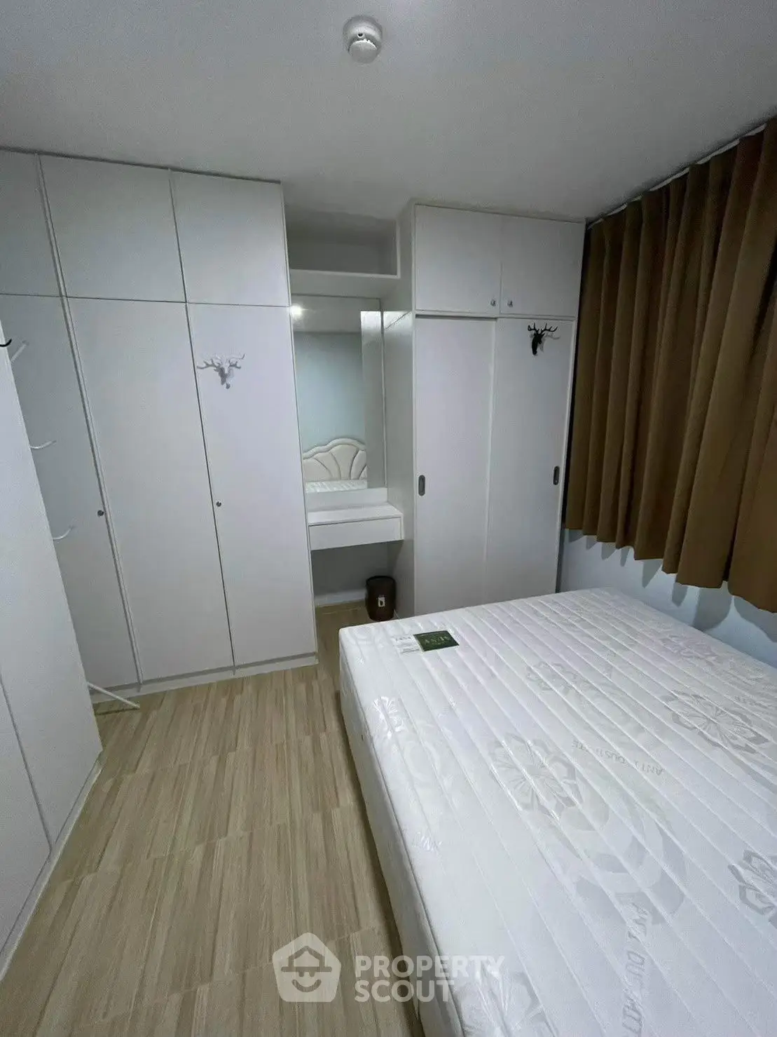 Cozy bedroom with ample storage and modern design