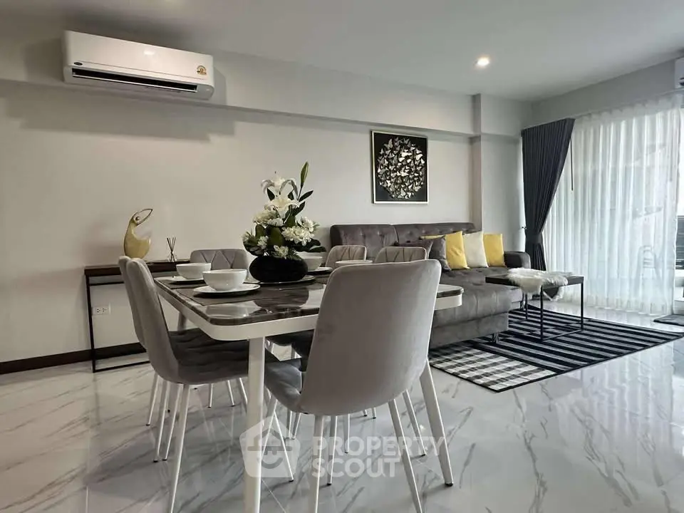 Modern living room with elegant dining area and stylish decor