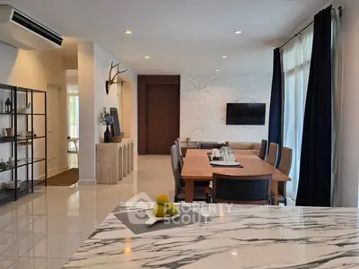 Spacious modern living room with elegant dining area and stylish decor