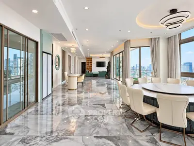Luxurious open-plan living room with marble floors and city skyline view