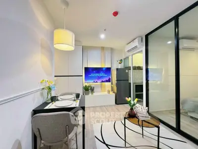 Modern living room with sleek design, glass partition, and cozy dining area in a stylish apartment.
