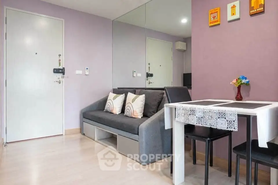 Modern living room with stylish decor and dining area in cozy apartment.