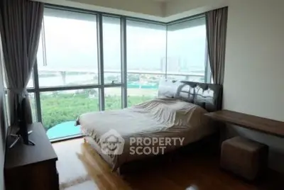 Spacious bedroom with stunning panoramic view and modern furnishings.