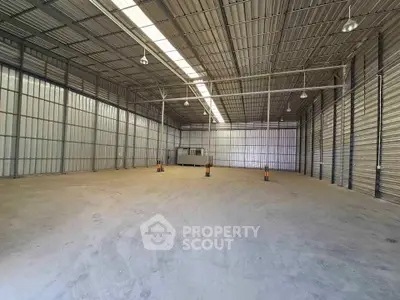 Spacious industrial warehouse with high ceilings and ample storage space