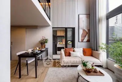 Modern living room with high ceilings and elegant decor in a luxury apartment.