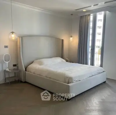 Luxurious bedroom with elegant lighting and modern decor