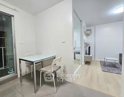 Modern apartment interior with dining area and cozy living room