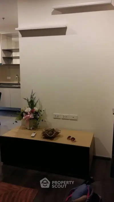 Modern apartment interior with stylish decor and open kitchen layout.