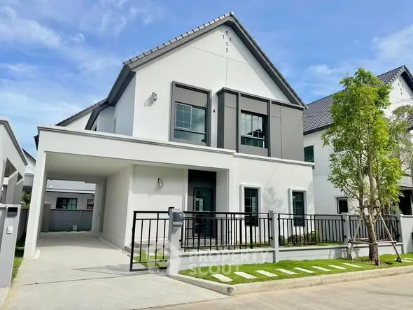 Modern two-story house with sleek design and spacious driveway