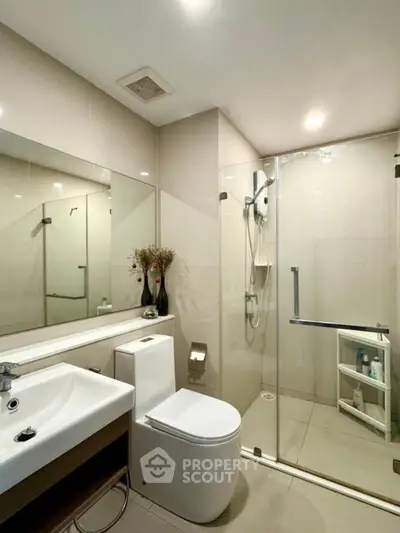 Modern bathroom with glass shower and sleek fixtures