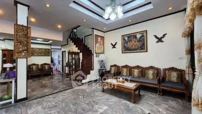 Elegant living room with wooden furniture and decorative ceiling lights