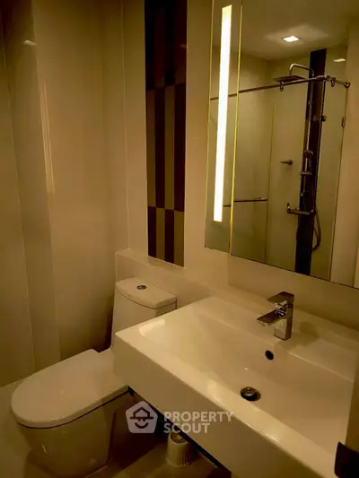 Modern bathroom with sleek fixtures and ambient lighting