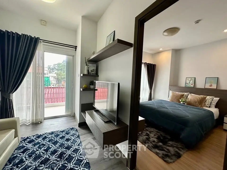 Modern apartment interior with cozy bedroom and stylish living area, featuring elegant decor and natural light.
