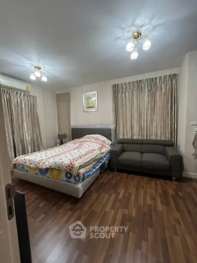 Spacious bedroom with elegant decor and cozy ambiance