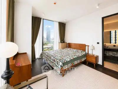 Spacious bedroom with city view in modern apartment