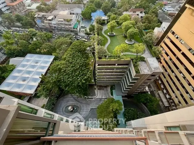Stunning aerial view of urban residential complex with lush gardens and modern architecture.