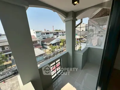 Charming balcony with urban view, perfect for relaxation and enjoying city life.