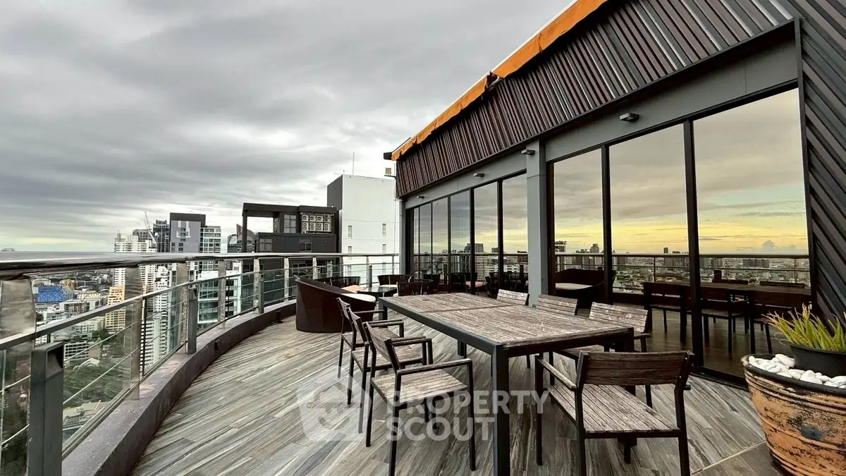 Stunning rooftop terrace with panoramic city views and modern outdoor seating.