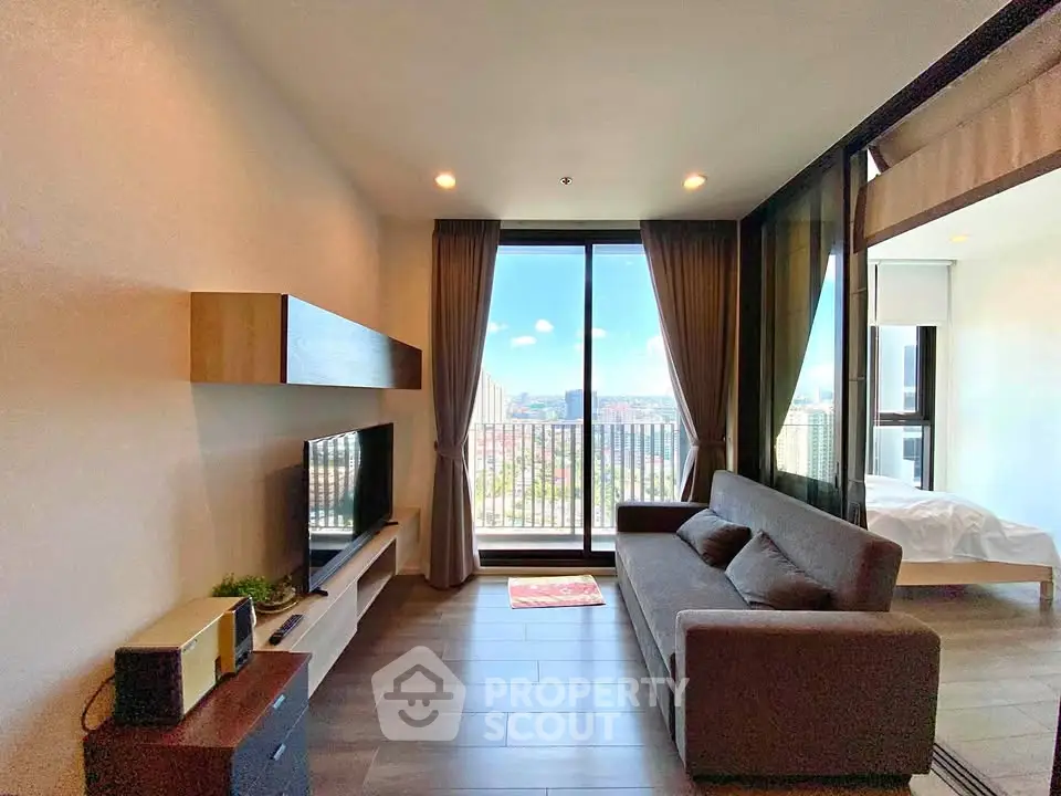 Modern living room with balcony view in high-rise apartment