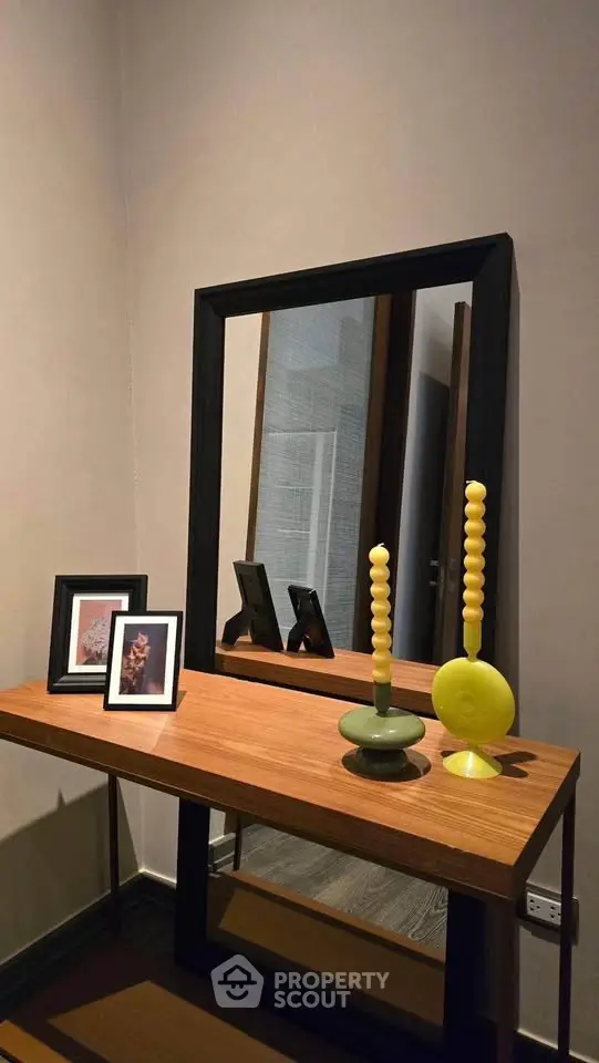Stylish modern interior with elegant wooden console table and decorative mirror, perfect for contemporary living spaces.