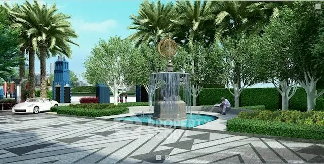 Luxurious landscaped garden with fountain and palm trees in upscale residential area.