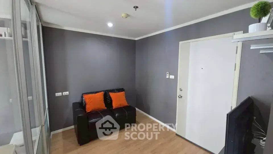 Cozy living room with modern decor and stylish furniture in a contemporary apartment.