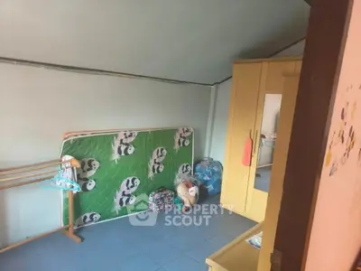 Cozy bedroom with panda-themed mattress and ample storage space