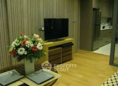 Modern living room with stylish decor and open kitchen layout