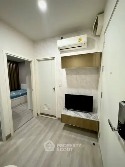 Modern apartment interior with air conditioning and TV setup