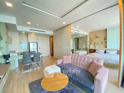 Spacious modern living room with open layout and stylish furniture in a luxury apartment.