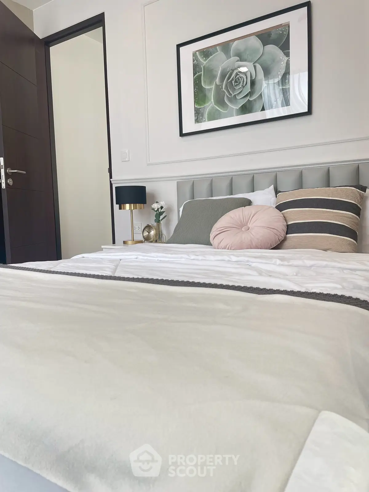 Stylish bedroom with modern decor and elegant bedding