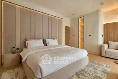 Luxurious modern bedroom with elegant lighting and plush bedding