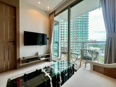 Modern living room with balcony view in high-rise apartment