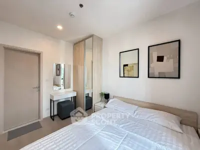 Modern bedroom with stylish decor and ample natural light