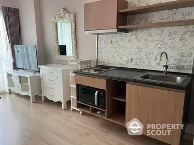 Charming kitchen space with modern appliances, elegant cabinetry, and a vintage mirror adding a touch of classic style to the interior.