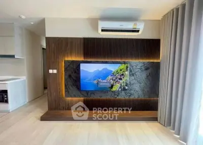 Modern living room with stylish TV wall and air conditioning unit