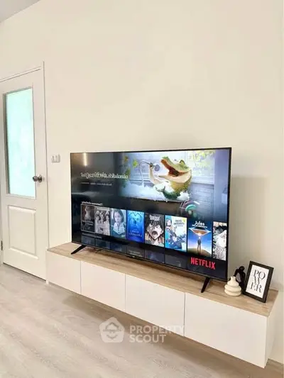 Modern living room with sleek TV setup and minimalist decor