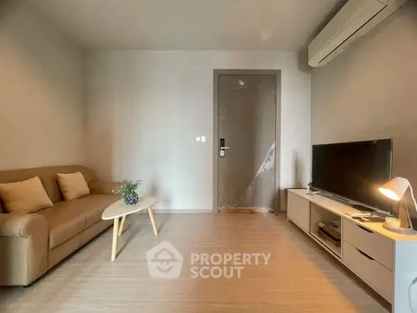 Modern living room with sleek furniture and air conditioning