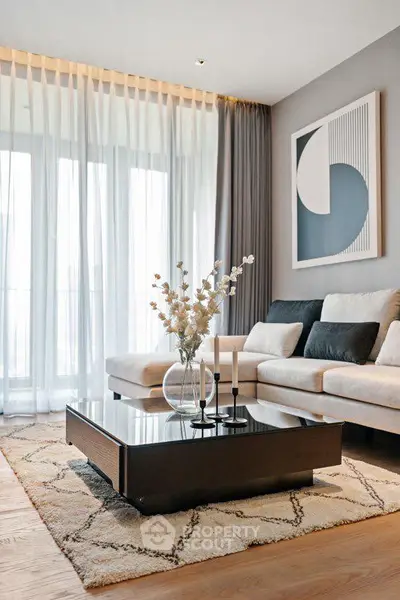 Elegant living room with modern decor and large windows