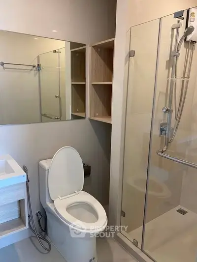 Modern bathroom with glass shower and sleek fixtures