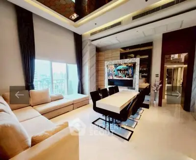 Luxurious modern living room with elegant dining area and large windows offering city views.