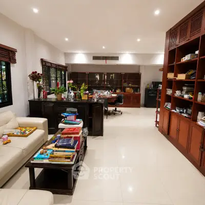 Spacious living room with elegant furniture and ample natural light, perfect for family gatherings.