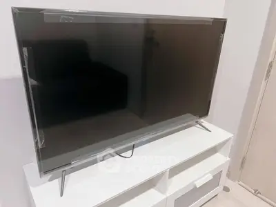 Modern living room with sleek TV on stylish white stand