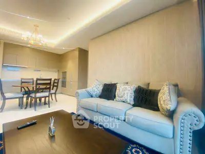 Elegant living room with modern decor and open kitchen layout